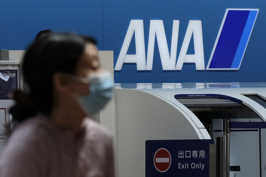 The logo of Japanese carrier All Nippon Airways (ANA) is seen in the departures floor of Tokyo's Haneda airport on April 28, 2020. (AFP)