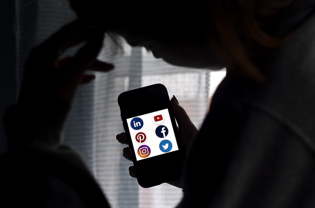 The ministry called for introducing a new system that would allow victims to ask courts to decide whether or not social media operators should disclose the requested information. (AFP)