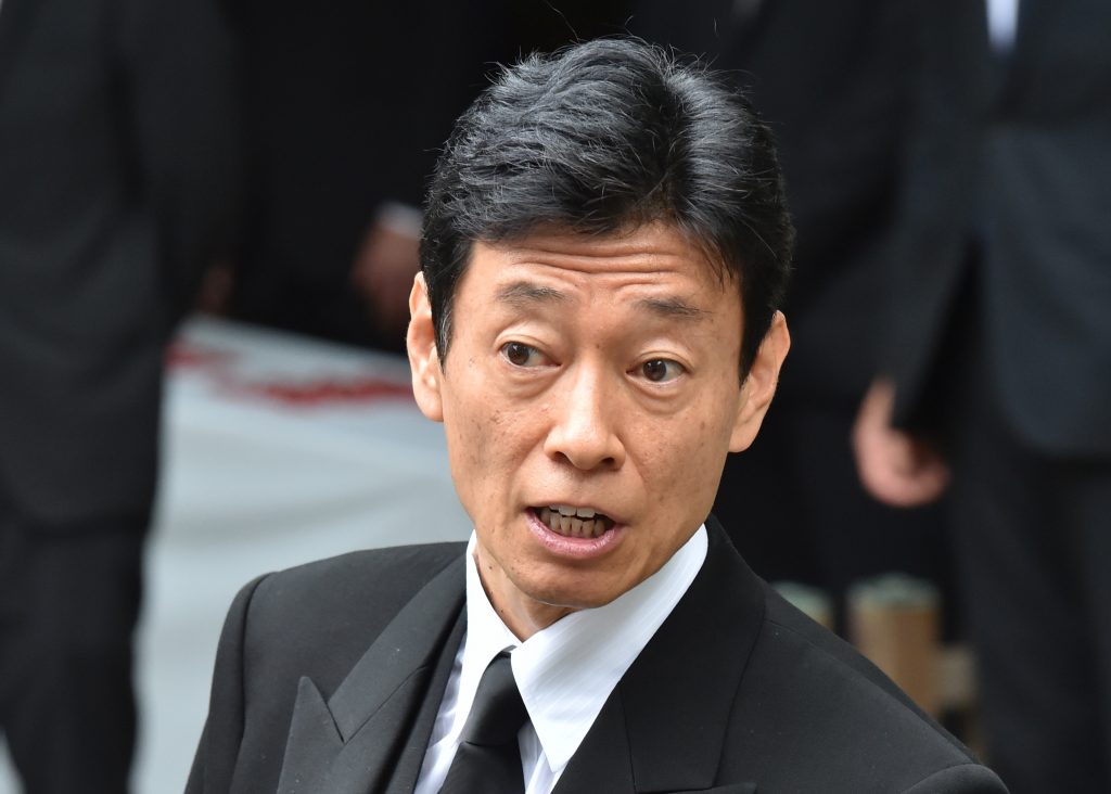 Closure of hospitality services will be one option if numbers continue rising, Yasutoshi Nishimura said July 11. (AFP)