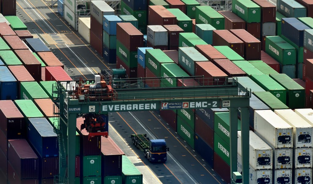 Shipping containers are seen at the cargo terminal area of Tokyo port on October 6, 2015. (AFP)