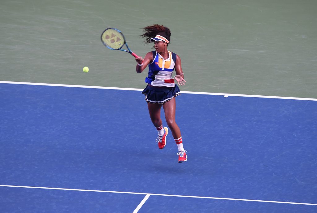 Naomi Osaka of Japan returns a shot to Angelique Kerber of Germany during the first round match of the Pan Pacific Open tennis tournament in Tokyo. (AFP)