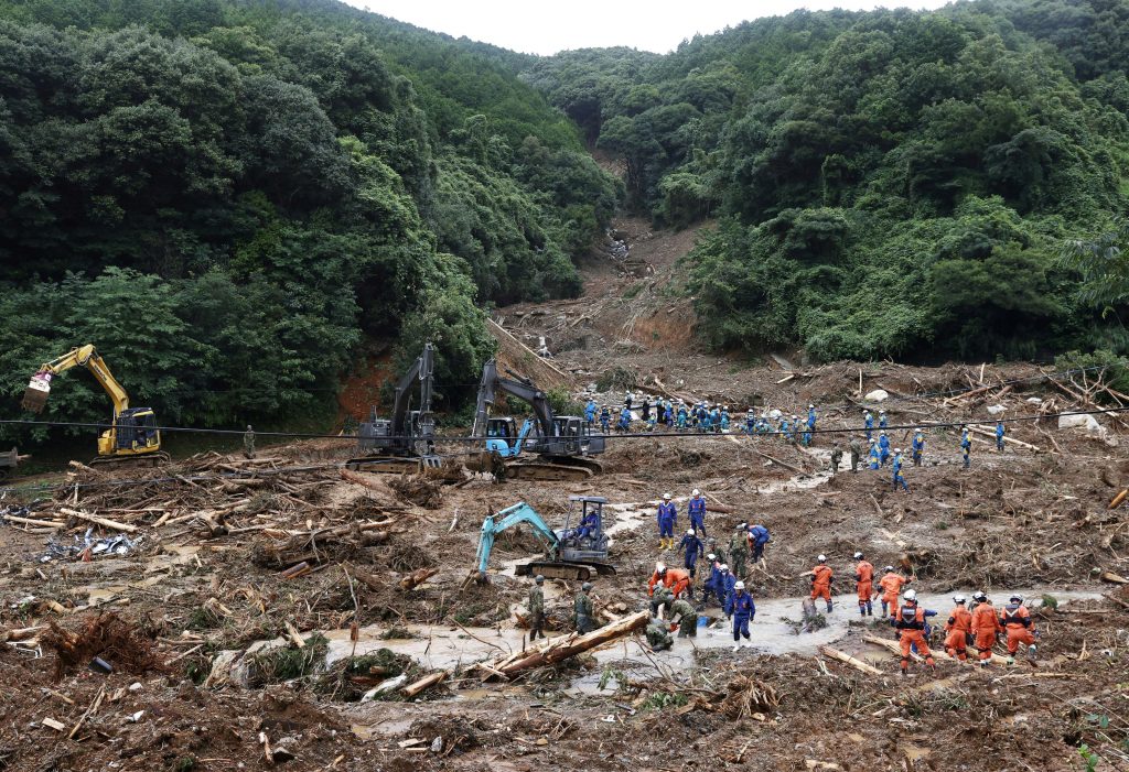 Rescue workers search for missing people at a landslide site caused by torrential rain in Tsunagi town, Kumamoto Prefecture, southwestern Japan, July. 6, 2020. (File photo/ Kyodo via Reuters)