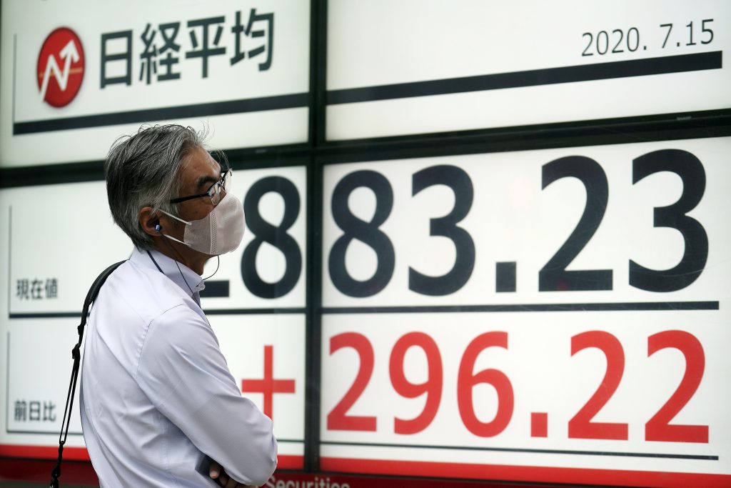 A man looks at an electronic stock board showing Japan's Nikkei 225 index at a securities firm in Tokyo, July 15, 2020. (File photo/AP) 