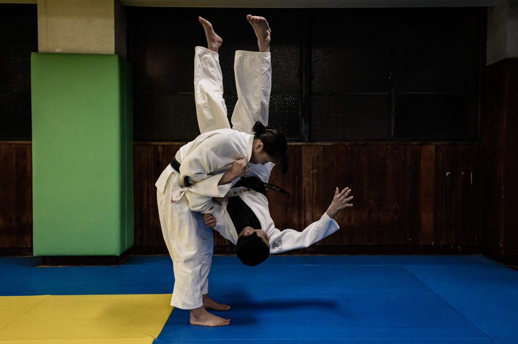  In this picture taken on February 25, 2020, judo students wrestle during a training session at Josho Gakuen senior high school in Osaka, where Kazunori Ohira (not pictured) - a veteran salesman from the Kusakura Japanese martial arts equipment manufacturer - goes personally to follow up on the sale of judo uniforms, known as 