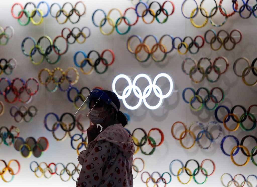 A woman wearing a protective face mask and face shield is seen inside Japan Olympics Museum, a day before the start of the one-year countdown to the Tokyo Olympics that have been postponed to 2021 due to the coronavirus disease (COVID-19) outbreak, in Tokyo, Japan July 22, 2020. (Reuters)