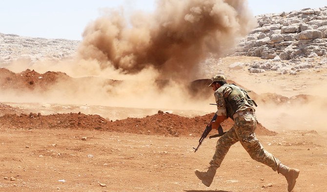 Members of Syria's opposition National Liberation Front take part in a military training in the northern countryside of Idlib province, on July 1, 2020. (AFP)