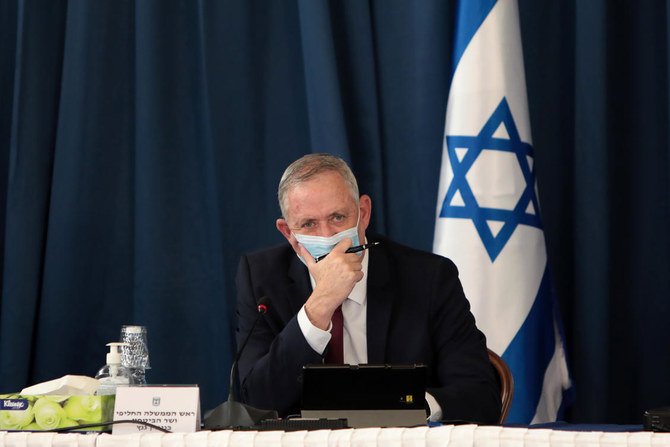 Israeli Defence Minister and alternate prime minister Benny Gantz wears a protective mask as he attends the weekly cabinet meeting at the foreign ministry in Jerusalem on July 5, 2020. (AFP)