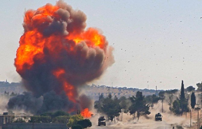 A fireball erupts from the site of an explosion reportedly targeting a joint Turkis-Russian patrol on the strategic M4 highway, near the Syrian town of Ariha in the rebel-held northwestern Idlib province, on July 14, 2020. (AFP)