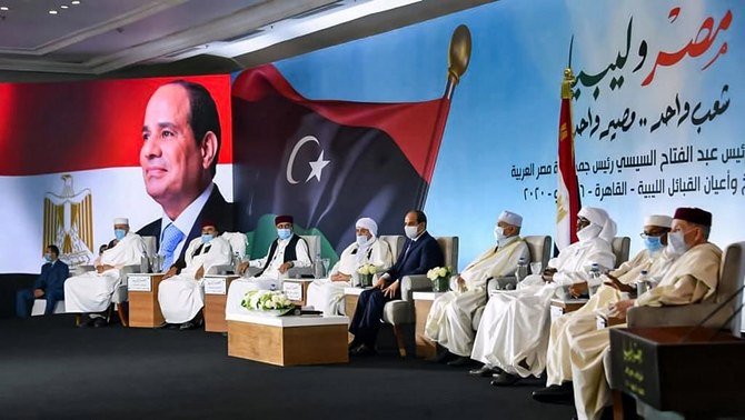 Above, President Abdel-Fattah El-Sisi hosts dozens of tribal leaders loyal to Khalifa Haftar in Cairo in a photo released by the presidential spokesman on July 16, 2020. (AFP)
