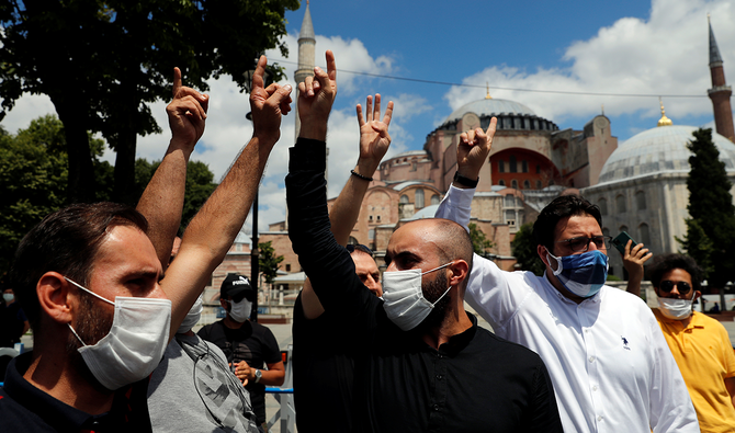 Turkish men shout slogans in front of the Hagia Sophia in Istanbul, Turkey, July 17, 2020. (Reuters)
