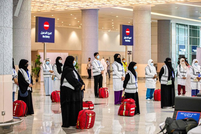 Saudi medics at the Jeddah airport await the first group of Hajj pilgrims. (AFP)