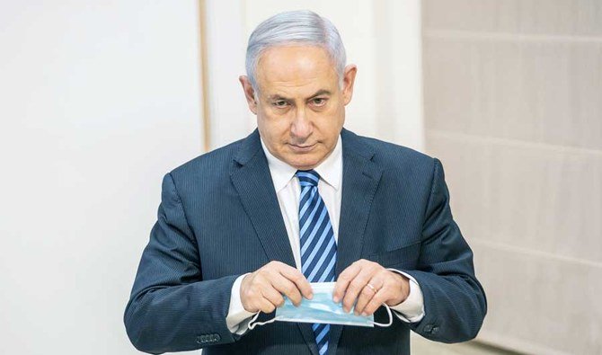 Israeli Prime Minister Benjamin Netanyahu issues a statement at the Israeli Defense Ministry in Tel Aviv, Israel with the Alternate PM and Defence Minister Benny Gantz July 27 2020, following the high tensions with the Lebanese militant group of Hezbollah at the Israeli-Lebanon border. (REUTERS)