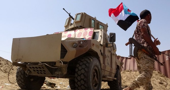 A fighter loyal to Yemen's separatist Southern Transitional Council (STC) holds the separatist flag in the southern Abyan province. (File/AFP)