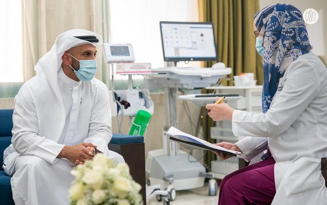 Abdullah bin Mohammed Al-Hamid, Chairman of the Department of Health in Abu Dhabi, was the first volunteer to participate in clinical trials taking place in Abu Dhabi for the third phase of the inactive vaccine for COVID-19. (Abu Dhabi Media Office)