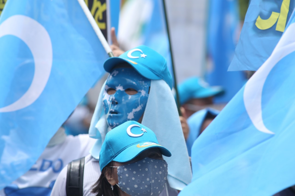 Taking to the streets of Tokyo, Uygurs and Tibetan minorities shouted slogans and carried banners calling for independence from what they term
