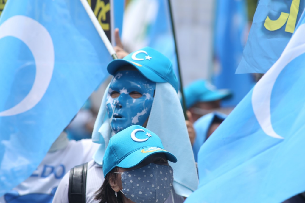 Taking to the streets of Tokyo, Uygurs and Tibetan minorities shouted slogans and carried banners calling for independence from what they term 