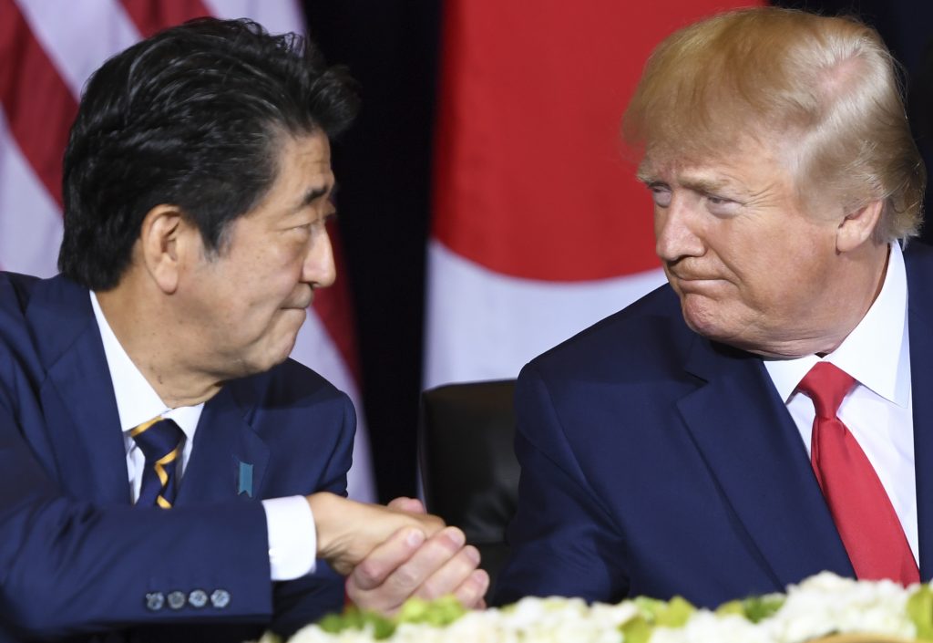Bolton suggested that Japanese Prime Minister Shinzo Abe's good personal relationship with Trump could have positive effects for Japan in its negotiations with the United States on costs for US bases in Japan. (AFP/file)