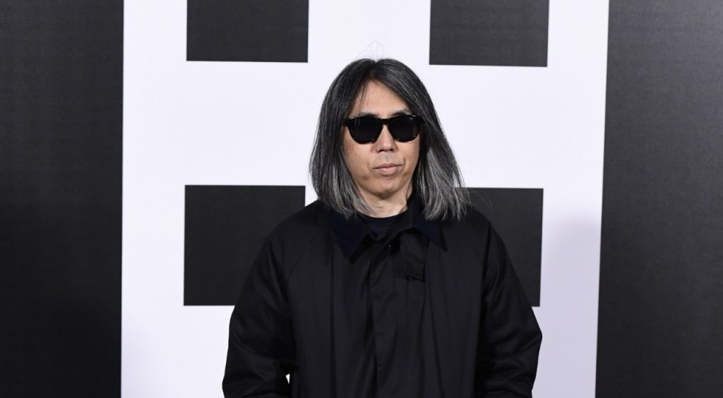Japanese musician, producer and designer Hiroshi Fujiwara poses upon his arrival to the women's Fall/Winter 2018/2019 collection fashion show by Moncler in Milan, Feb. 20, 2018. (AFP)