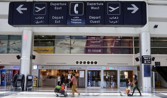 People push trollies, as they head to board a plane at Beirut International airport, Lebanon July 17, 2020. Picture taken July 17, 2020. (REUTERS)