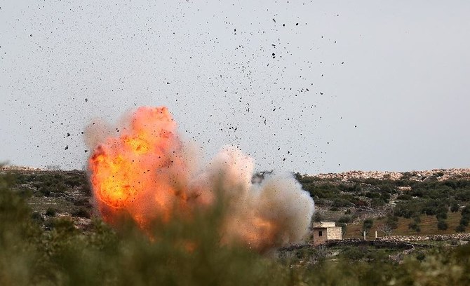 A picture taken on March 5, 2020 shows an explosion following Russian air strikes on the village of al-Bara in the southern part of Syria's northwestern province of Idlib. (File/AFP)
