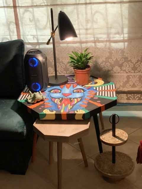 Nahla Ghafaili decided to paint away her boredom during the curfew but soon ran out of canvases, so decided to paint on objects in her home. (Photo/Supplied)