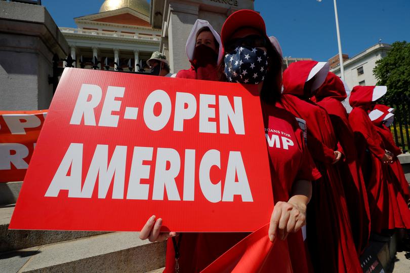 Demonstrators demand the lifting of restrictions imposed by state and local officials to fight the spread of COVID-19, Boston, May 30, 2020. (Reuters)