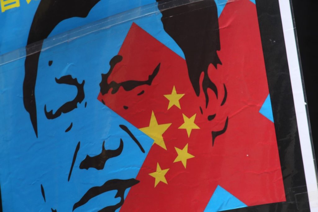 Taking to the streets of Tokyo, Uygurs and Tibetan minorities shouted slogans and carried banners calling for independence from what they term
