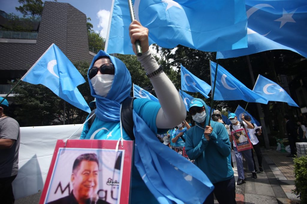 Taking to the streets of Tokyo, Uygurs and Tibetan minorities shouted slogans and carried banners calling for independence from what they term 