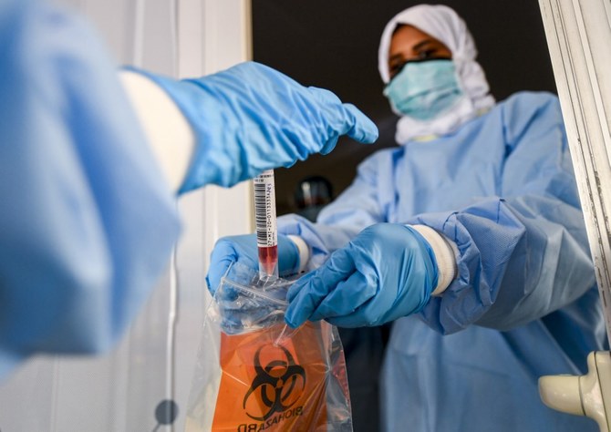 Volunteers will receive two doses of the vaccine within three weeks. (File/AFP)