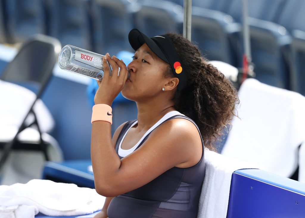 Naomi Osaka of Japan sits between points against Anett Kontaveit of Estonia during the Western & Southern Open at the USTA Billie Jean King National Tennis Center on August 26, 2020 in New York City. (AFP)