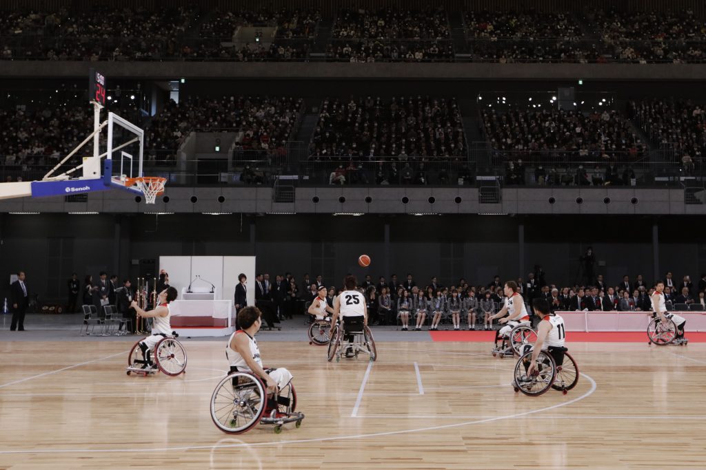 In this Feb. 2, 2020, file photo, members of Japan's national wheelchair basketball team warm up on the court during a grand opening ceremony of the Ariake Arena, a venue for volleyball at the Tokyo 2020 Olympics and wheelchair basketball during the Paralympic Games, in Tokyo. (AP)