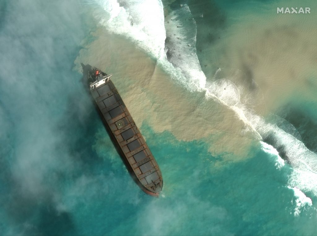 In this satellite image provided by 2020 Maxar Technologies on Friday, Aug. 7, 2020, an aerial view of the MV Wakashio, a bulk carrier ship that recently ran aground off the southeast coast of Mauritius. (2020 Maxar Technologies)