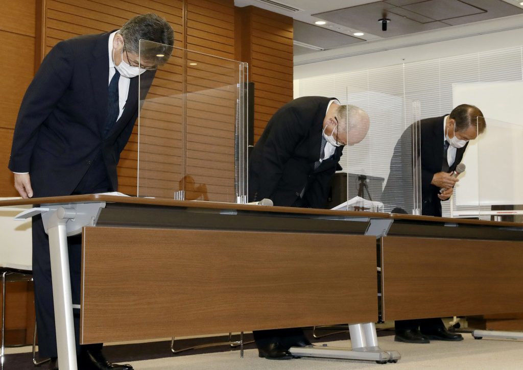  Managing Executive Officer Masanori Kato, Mitsui O.S.K.Lines, Ltd. Representative Director Akihiko Ono, and Nagashiki Shipping CEO Kiyoaki Nagashiki bow during a press conference in Tokyo, Sunday, Aug. 9, 2020. (File photo/Kyodo News via AP)