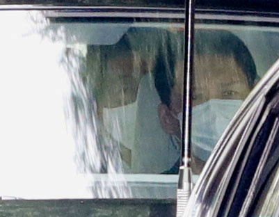 Japanese Prime Minister Shinzo Abe (L) arrives by car at Keio University Hospital in Tokyo, Japan, amid speculation about his health, in this photo taken by Kyodo, August 17, 2020. (Kyodo/via REUTERS) 