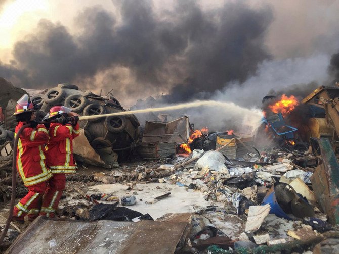 Firefighters spray water at a fire after an explosion was heard in Beirut. (Reuters)