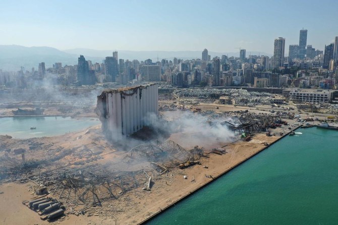 An aerial view shows the massive damage done to Beirut port's grain silos (C) and the area around it on August 5, 2020, one day after a mega-blast tore through the harbour in the heart of the Lebanese capital with the force of an earthquake, killing more than 100 people and injuring over 4,000. (AFP)
