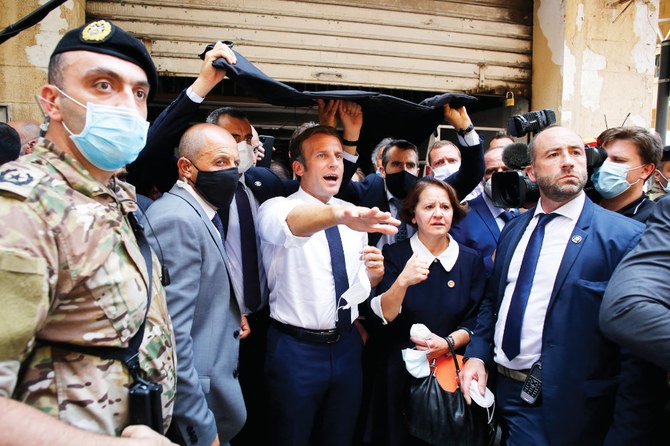 French President Emmanuel Macron visited Beirut on Thursday, pledging support and urging change after massive explosions at the port devastated the Lebanese capital in a disaster that has sparked grief and fury. (AFP)