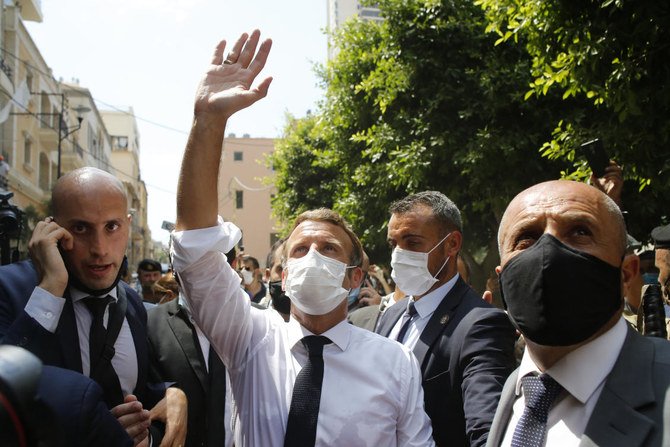 French President Emmanuel Macron gestures toward residents as he visits a devastated street of Beirut, Lebanon, Thursday Aug.6, 2020. (File/AP)