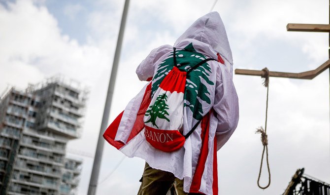 A Lebanese protester hangs a gallow in downtown Beirut on August 8, 2020, following a demonstration against a political leadership they blame for a monster explosion that killed more than 150 people and disfigured the capital Beirut. (AFP)