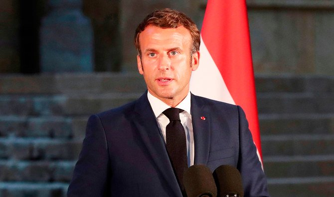 French President Emmanuel Macron delivers his speech during a press conference in Beirut on Thursday, two days after a massive explosion devastated the Lebanese capital. (AFP)