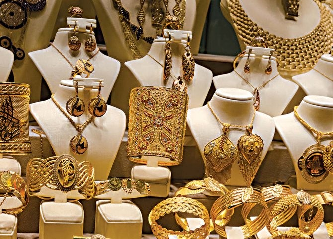 Gold vendors at bazaars (above) have found ready buyers for things like antique Turkish coins (inset). (Shutterstock)