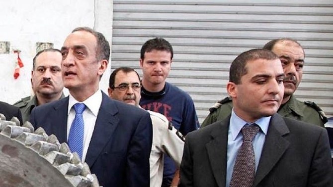 Former Lebanese Customs chief Shafik Merhi, left, and current Customs chief Badri Daher, right, at the Port of Beirut, May 17, 2010. (AP Photo)
