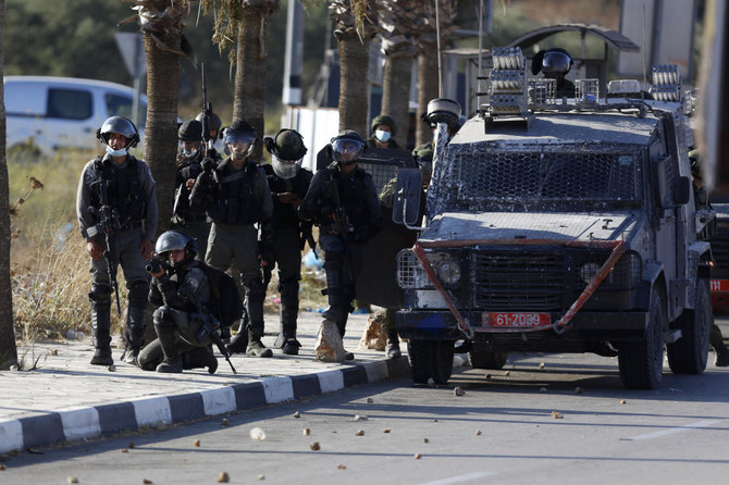 Israeli forces clash with Palestinians during a rally against Israel’s plan to annex parts of the West Bank and US President Donald Trump’s Mideast initiative. (File/AP)