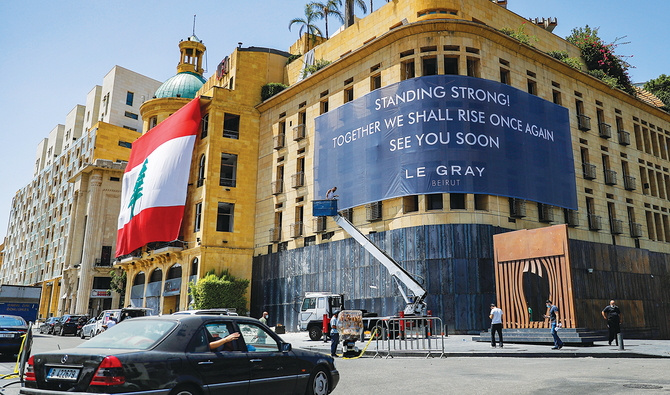 A view of the landmark Le Gray hotel in the center of Lebanon’s capital Beirut overlooking the Martyrs’ Square, as a banner is hung across its facade. (AFP)