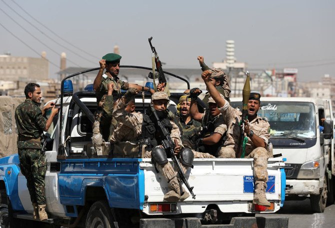Houthi troops ride on the back of a police patrol truck after participating in a Houthi gathering in Sanaa, Yemen Feb. 19, 2020. (Reuters)
