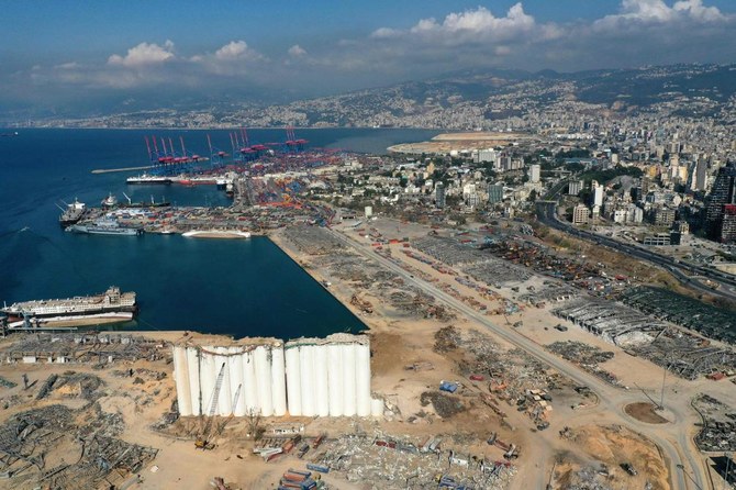 An aerial view taken on August 26, 2020, shows the port of Beirut with the grain silo in the foreground and surrounding neighborhoods, devastated in the August 4 massive explosion. (AFP)