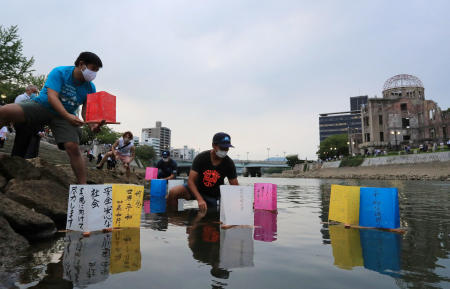 People release paper lanterns on the Motoyasu River facing the gutted Atomic Bomb Dome in remembrance of atomic bomb victims in Hiroshima, Japan. (Reuters)