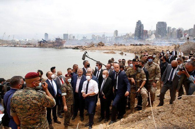 French President Emmanuel Macron visits the devastated site of the explosion at the port of Beirut, Lebanon on August 6, 2020. (Reuters)