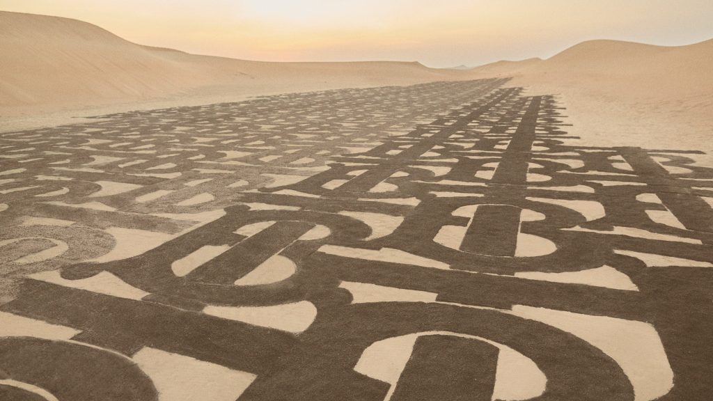 Burberry celebrates the Thomas Burberry Monogram introduced in the new TB Summer Monogram collection in the arid desert landscape of Dubai, UAE. (Supplied/Burberry)