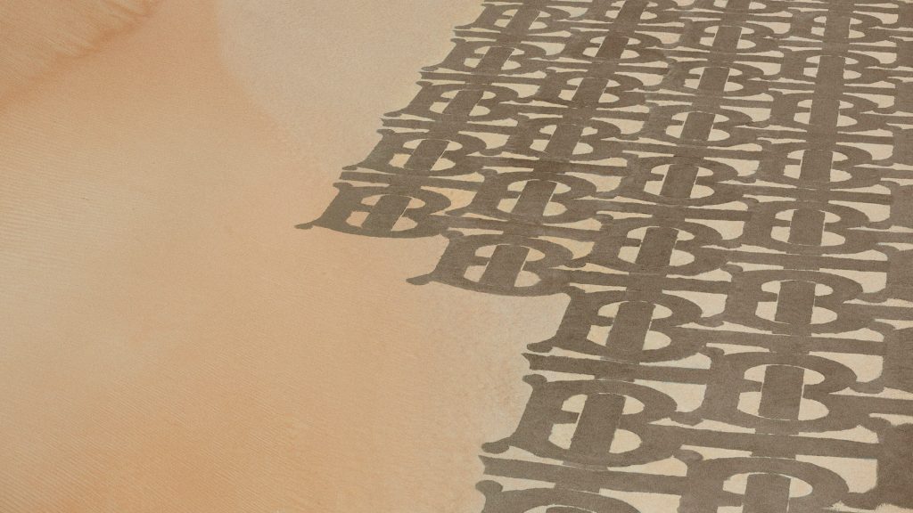 Burberry celebrates the Thomas Burberry Monogram introduced in the new TB Summer Monogram collection in the arid desert landscape of Dubai, UAE. (Supplied/Burberry)